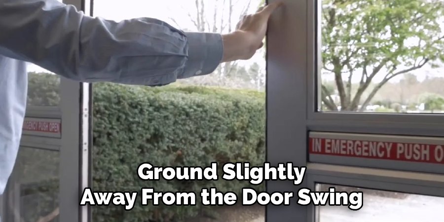 Ground Slightly Away From the Door Swing