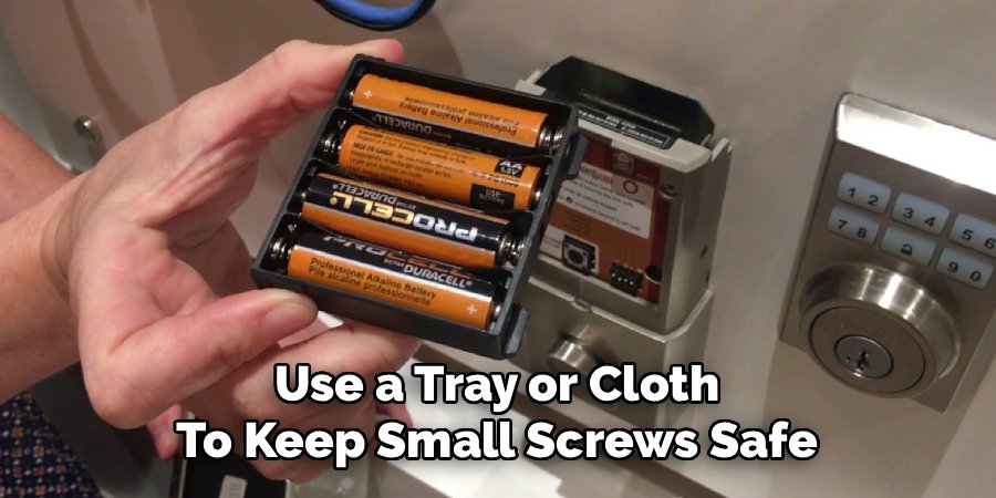 Use a Tray or Cloth
To Keep Small Screws Safe