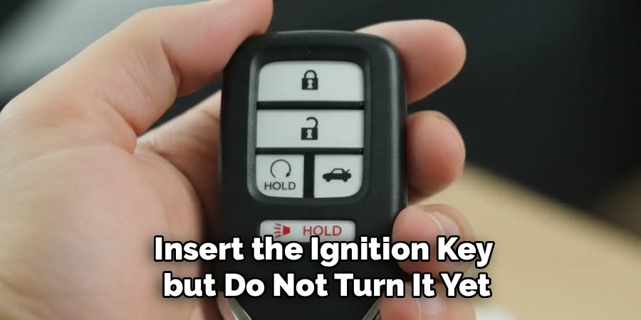 Insert the Ignition Key
 but Do Not Turn It Yet