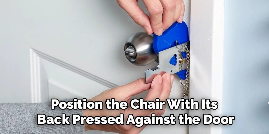 Position the Chair With Its
Back Pressed Against the Door