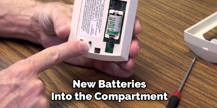 New Batteries Into the Compartment
