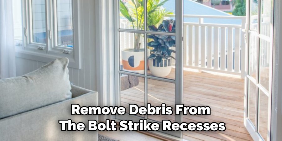 Remove Debris From 
The Bolt Strike Recesses