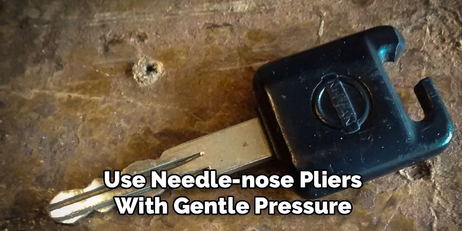 Use Needle-nose Pliers
With Gentle Pressure